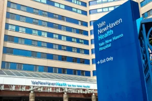 Yale New Haven Health Hospital main building, home to one of the largest healthcare uniform programs powered by Work Hard Dress Right.