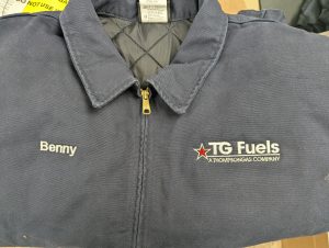 Personalized Thompson Gas work jacket with embroidered employee name and company logo.