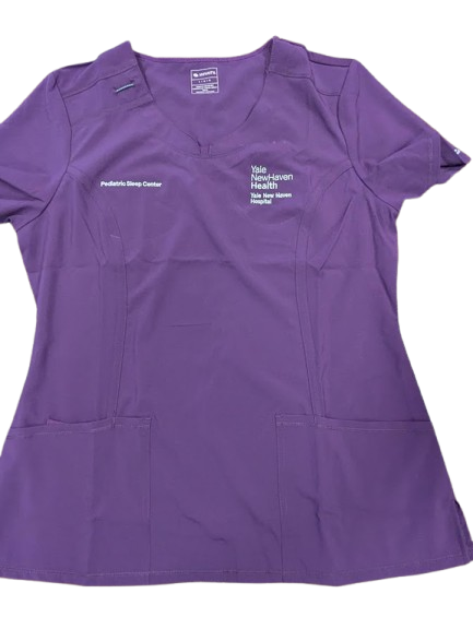 Scrub top embroidered with healthcare organization and professional identification